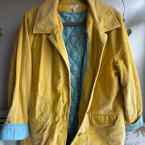 Jill yellow corduroy jacket with a light blue quilted lining.